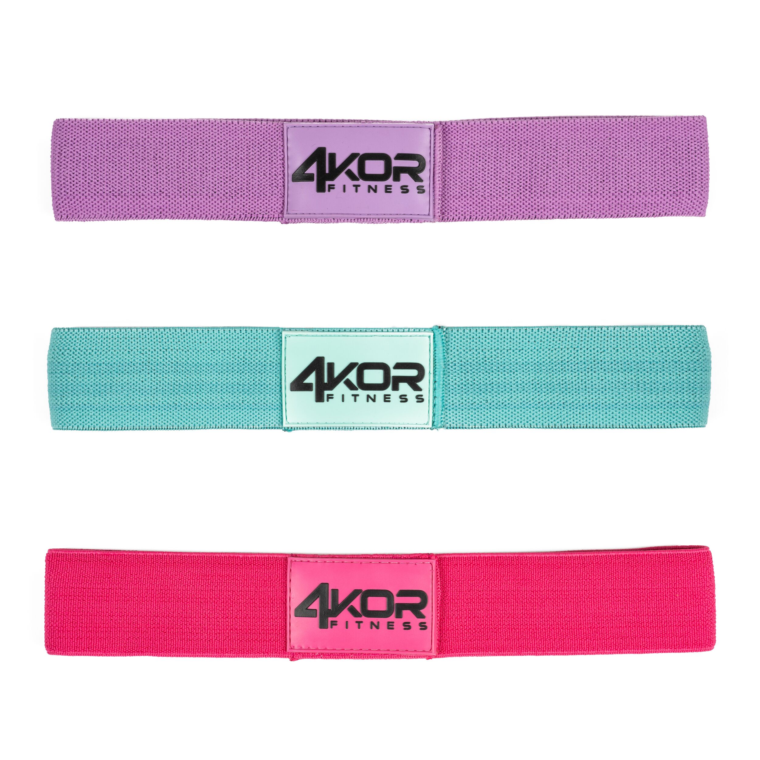 Three 4KOR Fitness solid-color fabric resistance bands in purple, teal, and coral pink on white background