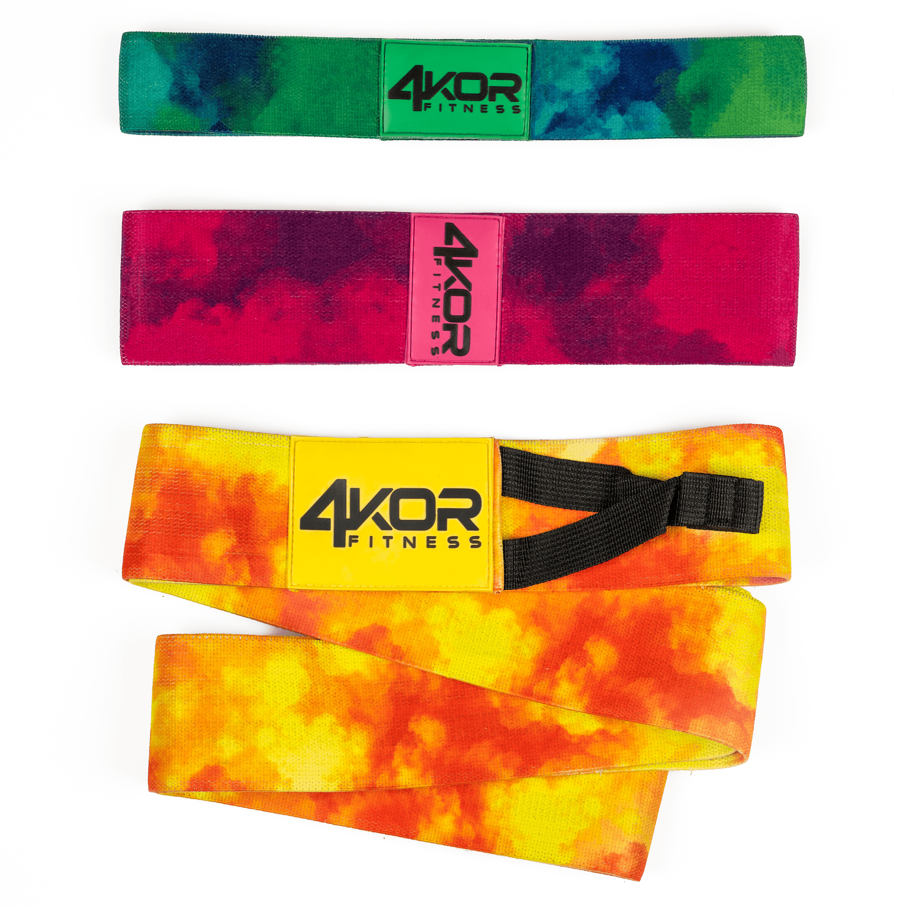 Three 4KOR Fitness tie-dye resistance bands on white background: green-blue hip band, red-purple hip band, and yellow-orange long band